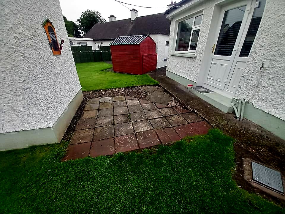 Before: old worn slabs beside the back door
