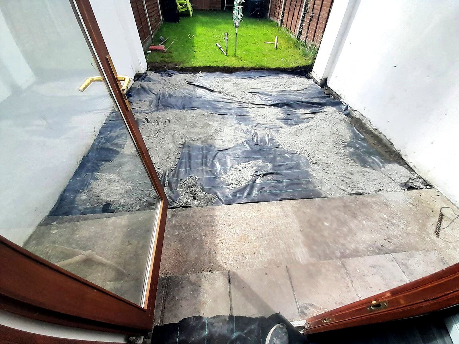 Weed membrane laid across the patio area