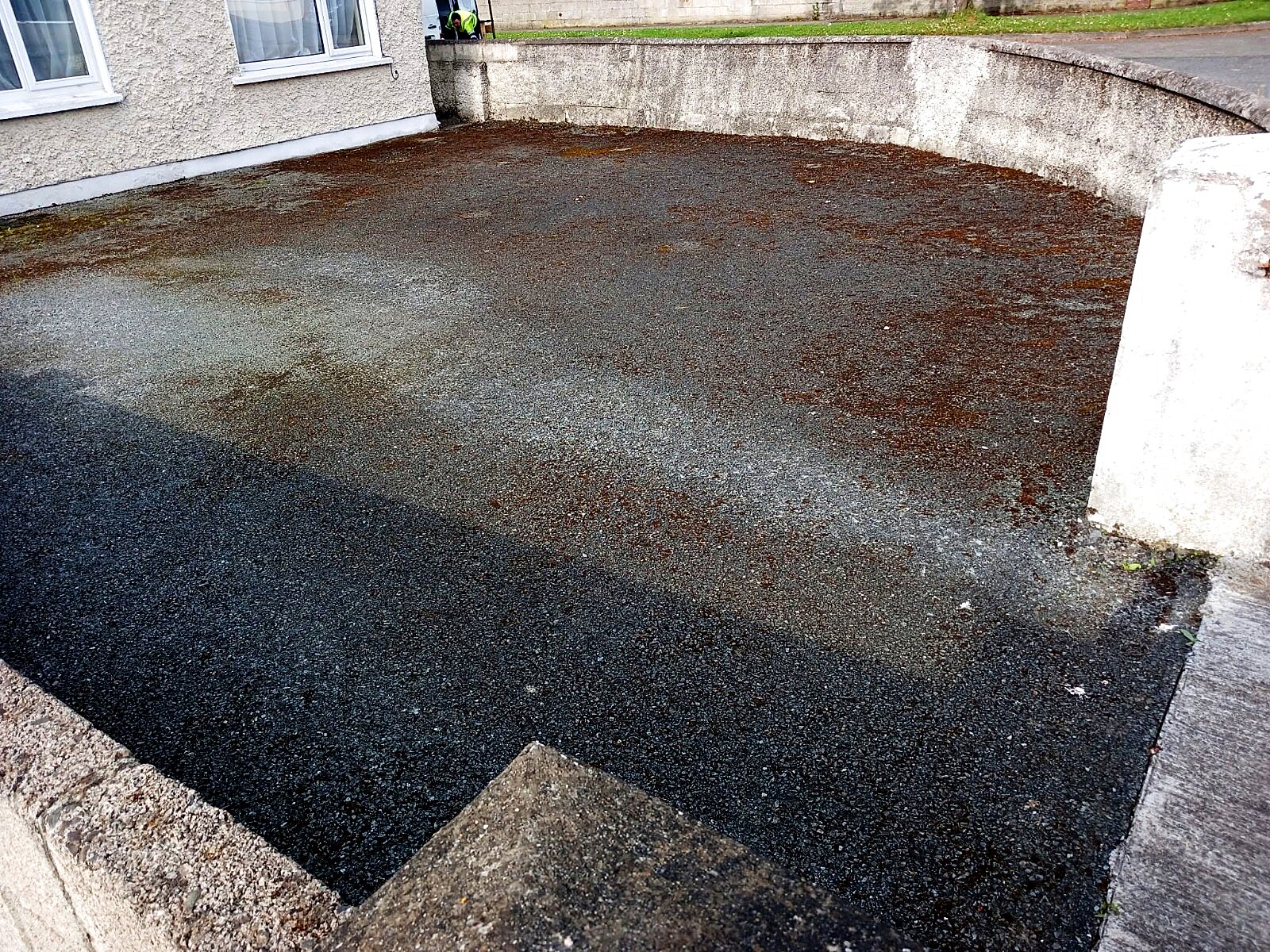 Worn, weathered tarmac driveway before the Topline transformation